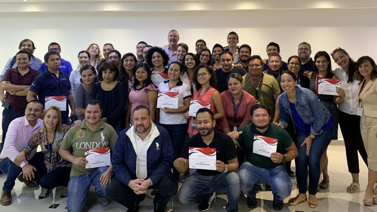 Participants celebrating their program certificates